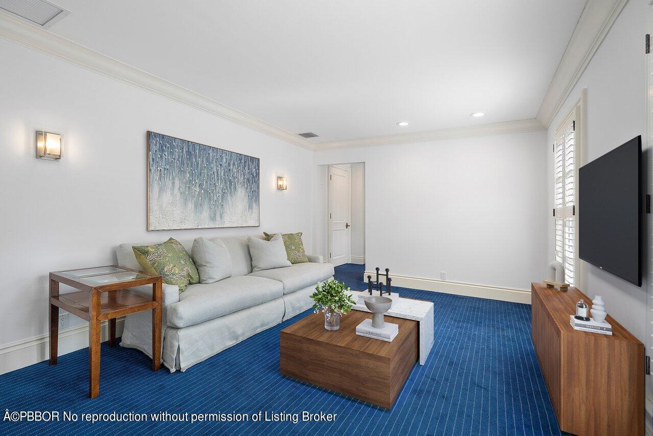 168 Kings Road Palm Beach, FL 33480 - Photo 40 of 51 a living room with furniture and a flat screen tv