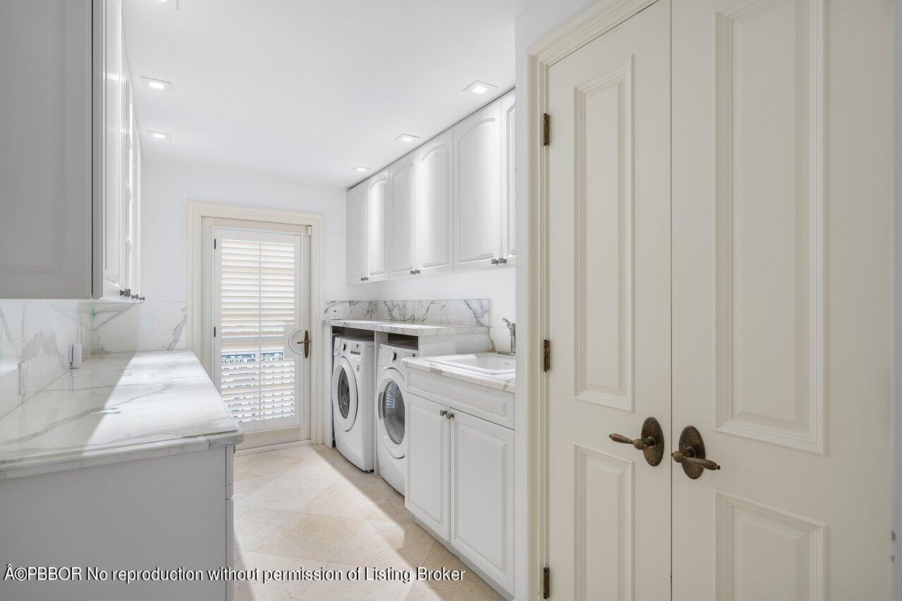 168 Kings Road Palm Beach, FL 33480 - Photo 46 of 51 a kitchen with a sink a stove a refrigerator and cabinets