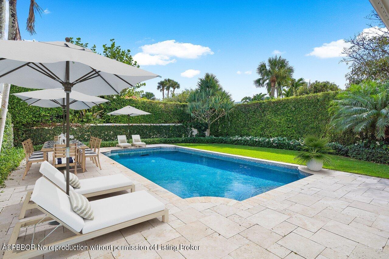 168 Kings Road Palm Beach, FL 33480 - Photo 49 of 51 a view of a swimming pool with a patio