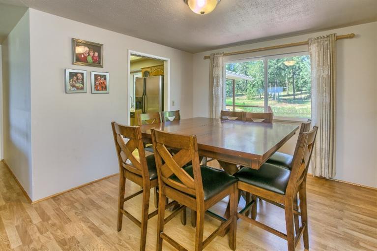 1600 Rounds Avenue Grants Pass, OR 97527 - Photo 16 of 35 a view of a dining room with furniture window and wooden floor