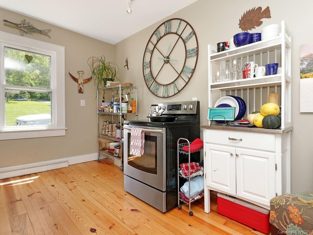 315 Shoals Falls Road Hendersonville, NC 28739 - Photo 11 of 47 a utility room with painting on the wall and a window