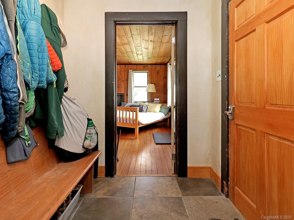 315 Shoals Falls Road Hendersonville, NC 28739 - Photo 27 of 47 a view of living room filled with furniture and a window