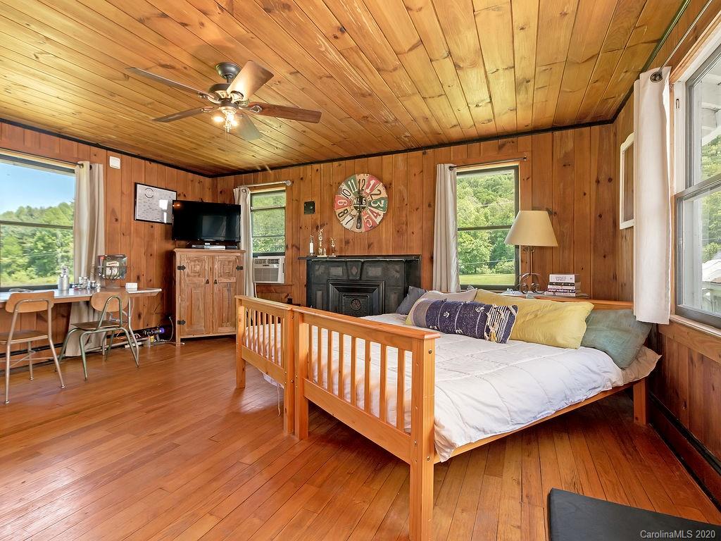 315 Shoals Falls Road Hendersonville, NC 28739 - Photo 28 of 47 a view of a dining room with furniture window and wooden floor