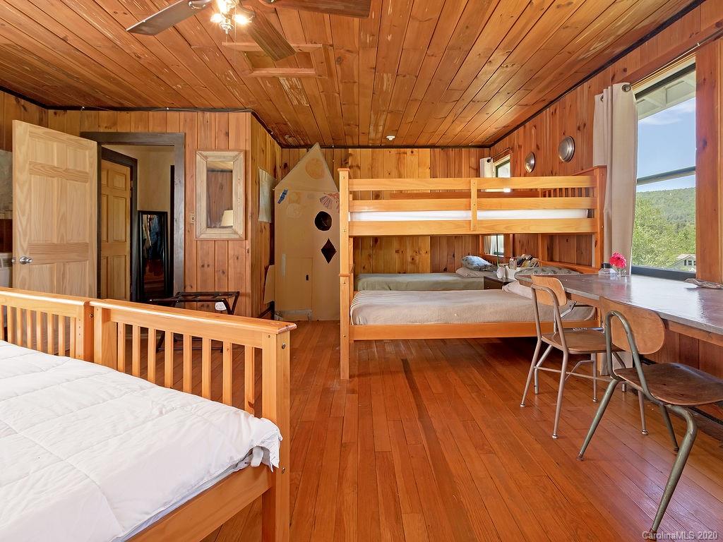 315 Shoals Falls Road Hendersonville, NC 28739 - Photo 29 of 47 a view of a patio with a table and chairs