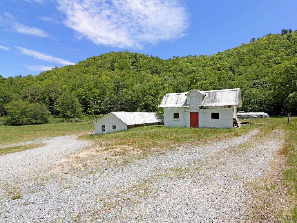 315 Shoals Falls Road Hendersonville, NC 28739 - Photo 33 of 47 a view of a house with a yard