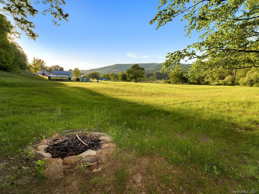 315 Shoals Falls Road Hendersonville, NC 28739 - Photo 39 of 47 a view of a lake with an outdoor space