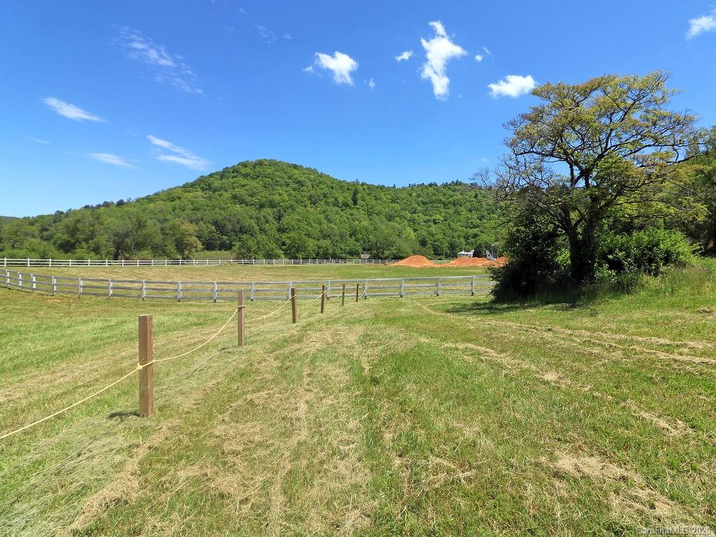 315 Shoals Falls Road Hendersonville, NC 28739 - Photo 44 of 47 a view of an ocean and a yard