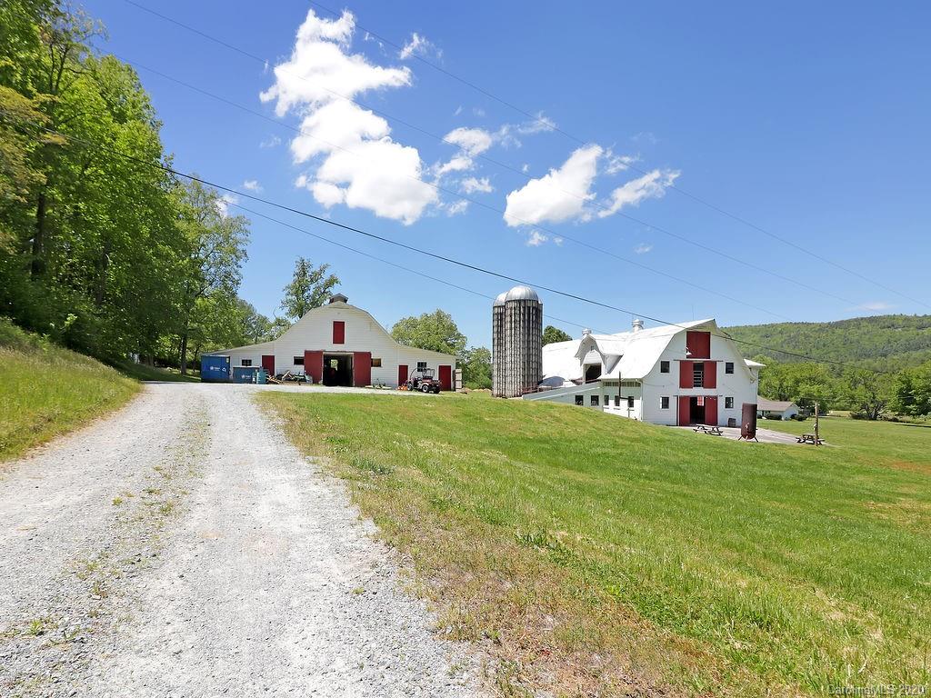 315 Shoals Falls Road Hendersonville, NC 28739 - Photo 46 of 47 a view of a house with a yard and garage