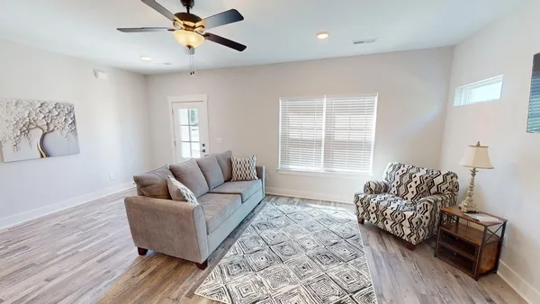 a living room with furniture and a window