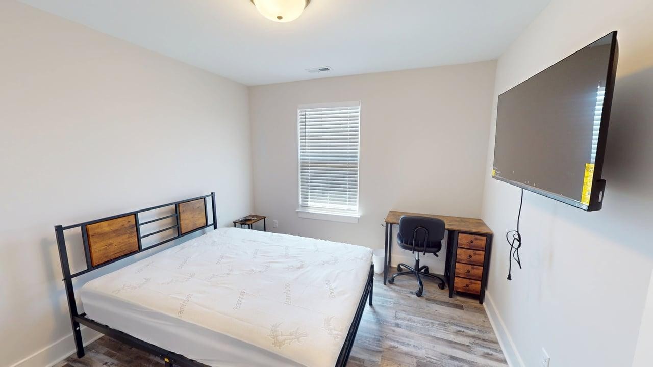 2315 Gold Valley Drive, Unit B1 Murfreesboro, TN 37130 - Photo 10 of 16 a bedroom with a bed and a chair