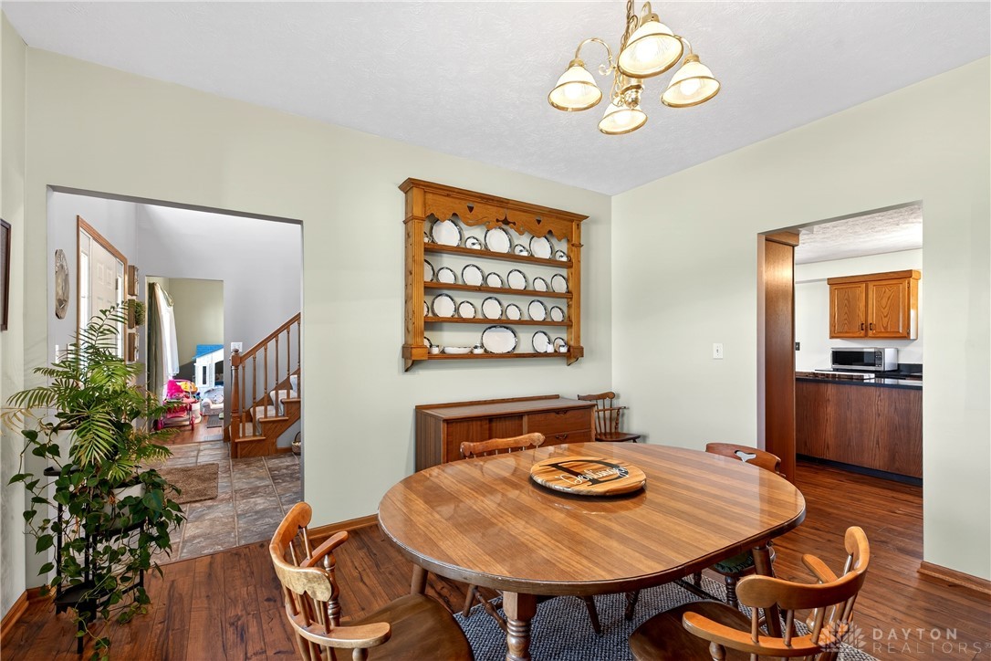 6560 Snyder Road Fletcher, OH 45326 - Photo 10 of 71 This inviting dining area features elegant wood flooring, perfect for family meals and entertaining.
