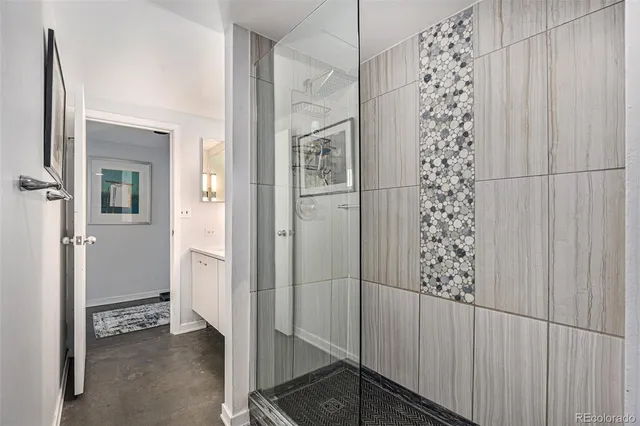 a bathroom with a double vanity sink and a mirror