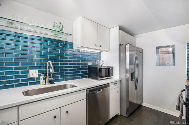 a kitchen with a stove and a refrigerator