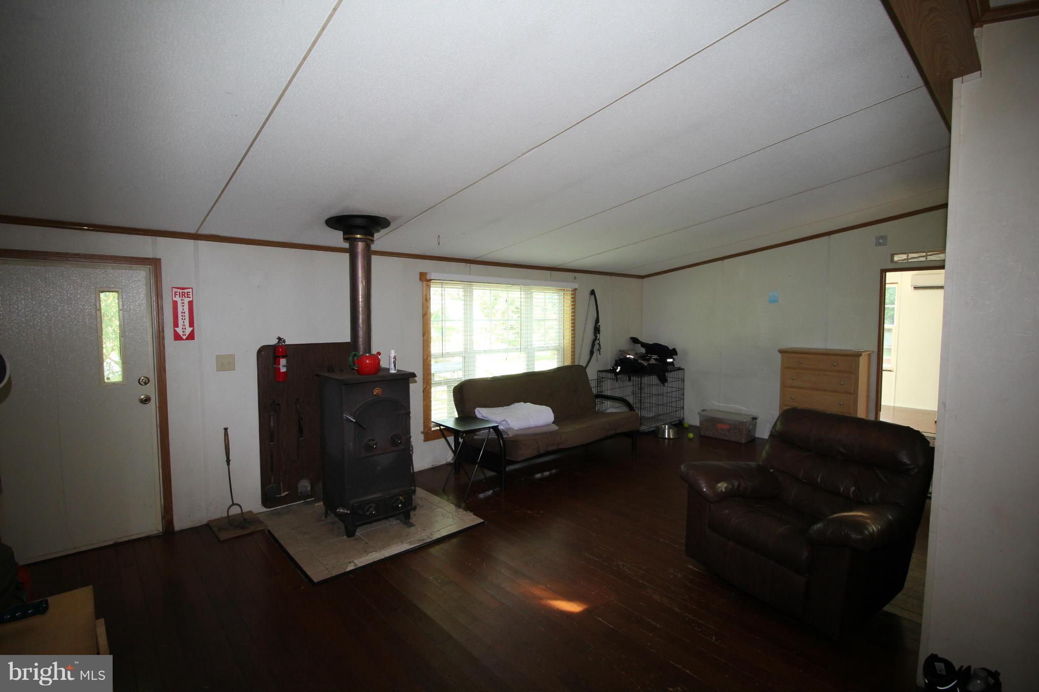 2178 Cecilton Warwick Road Warwick, MD 21912 - Photo 21 of 28 Living Room with Woodstove