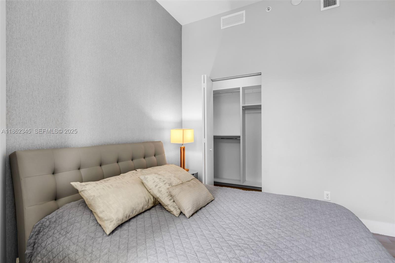 501 Northeast 31st Street, Unit 306 Miami, FL 33137 - Photo 12 of 65 a living room with furniture and a lamp