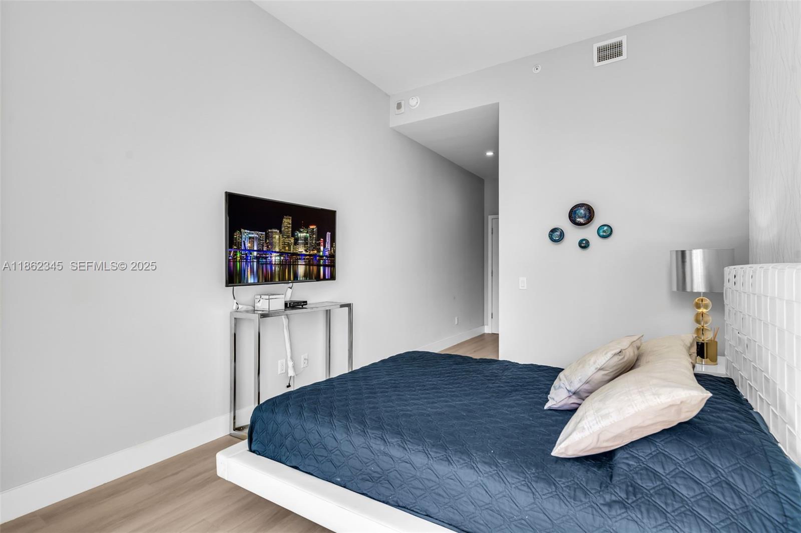 501 Northeast 31st Street, Unit 306 Miami, FL 33137 - Photo 22 of 65 a living room with furniture and a wooden floor