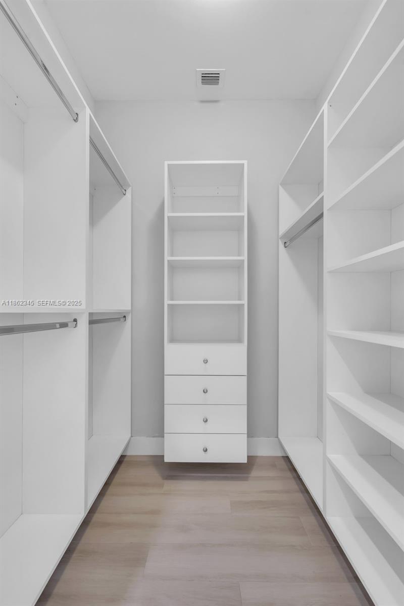 501 Northeast 31st Street, Unit 306 Miami, FL 33137 - Photo 24 of 65 a view of an empty walk in closet