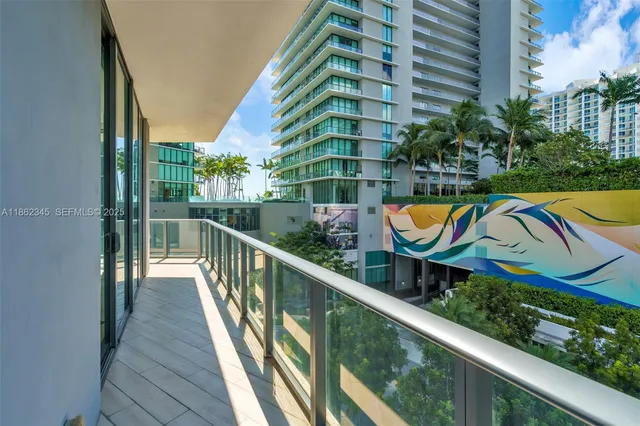 an aerial view of a house with swimming pool and outdoor seating