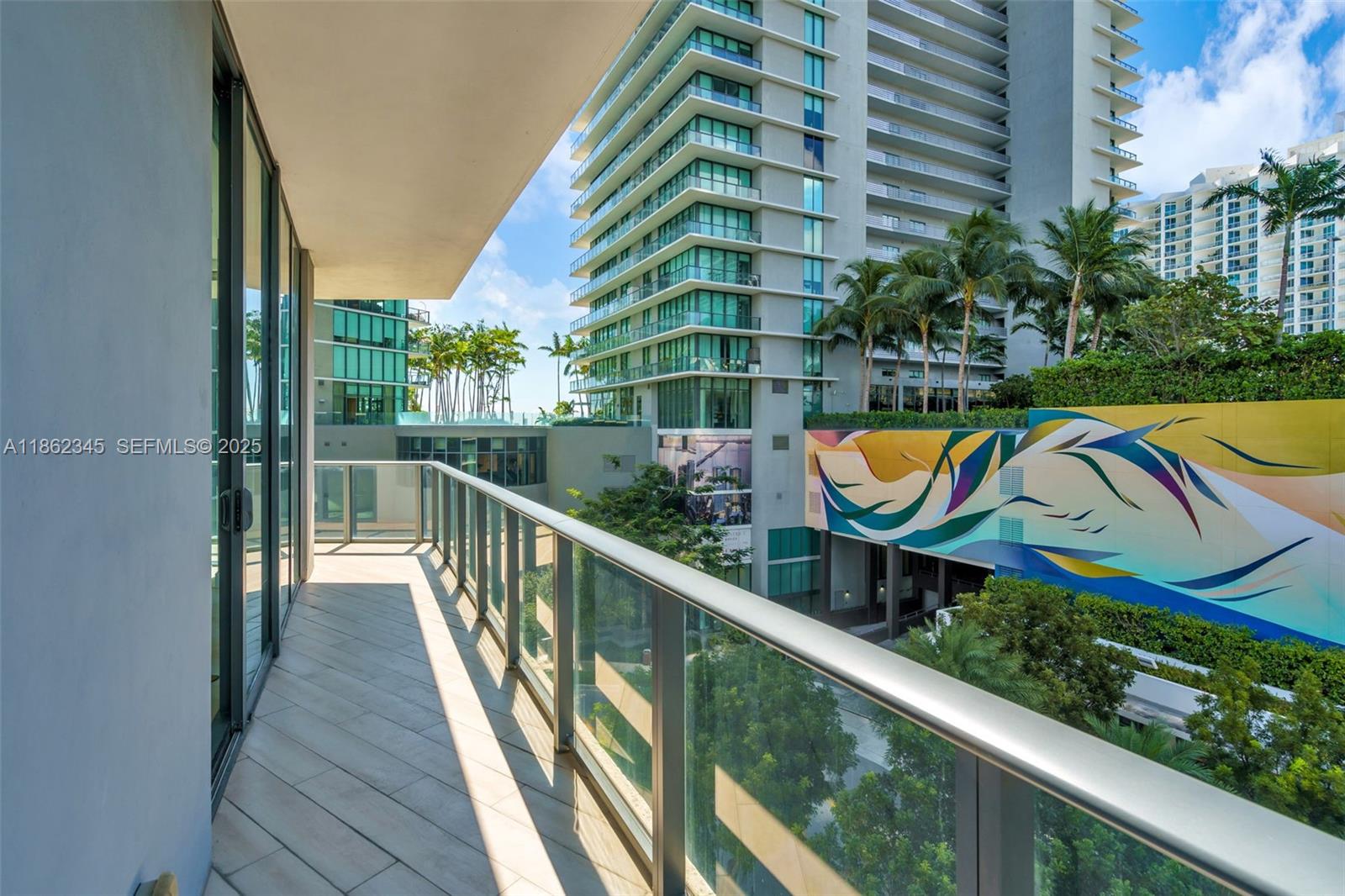501 Northeast 31st Street, Unit 306 Miami, FL 33137 - Photo 25 of 65 a view of a swimming pool with a lounge chairs