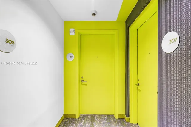 a living room with table tennis pool table and chairs