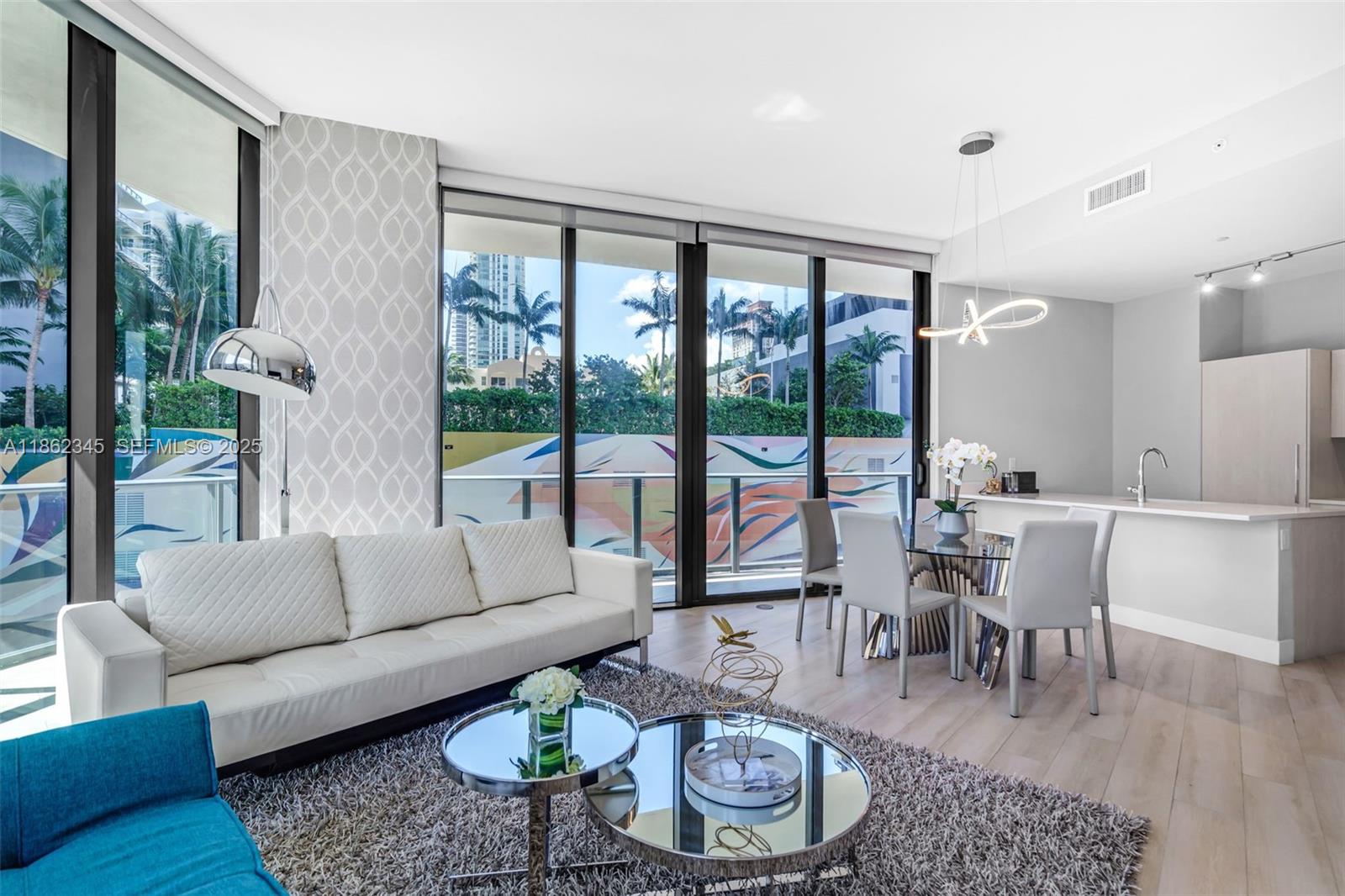 501 Northeast 31st Street, Unit 306 Miami, FL 33137 - Photo 5 of 65 a living room with furniture and a large window