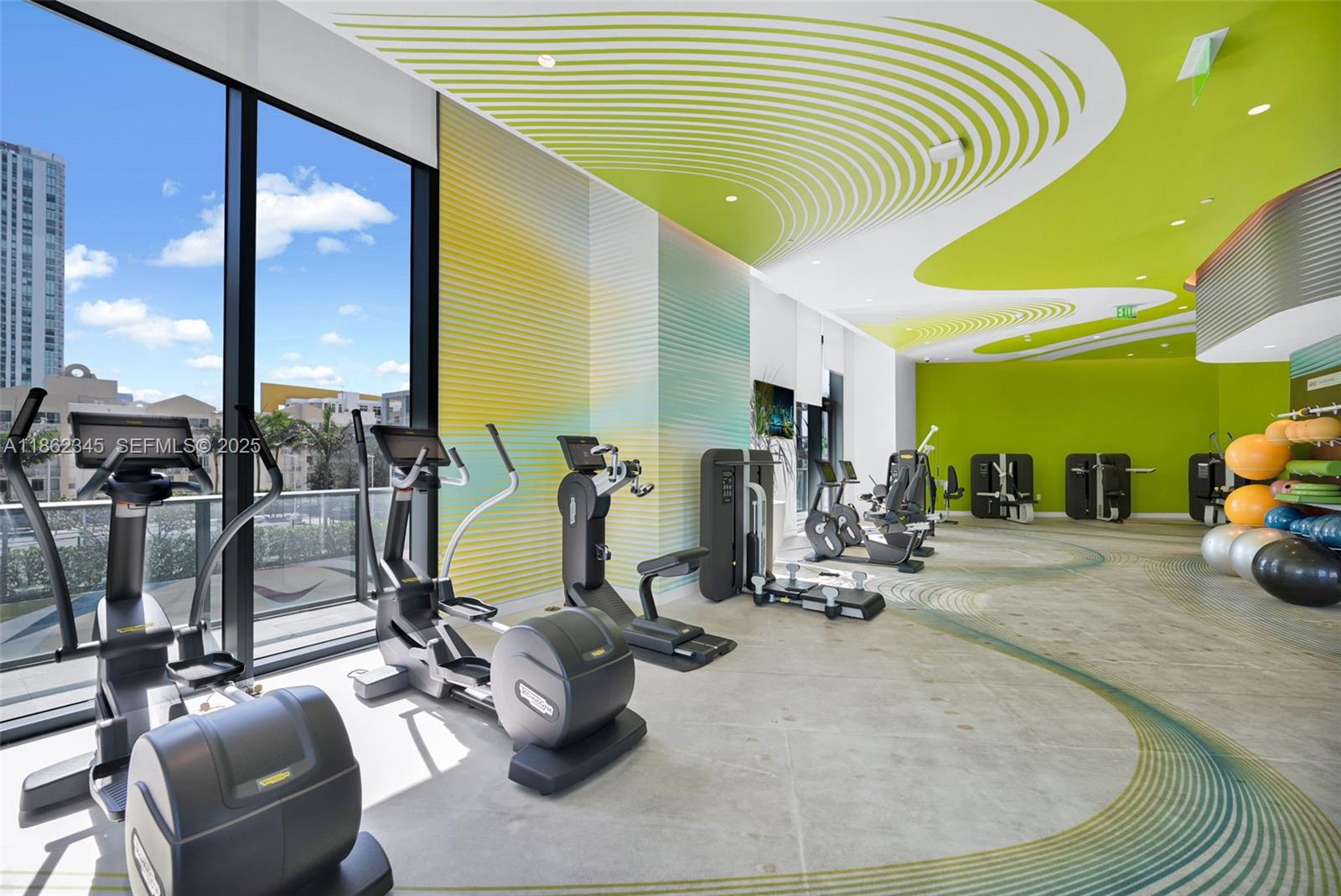 501 Northeast 31st Street, Unit 306 Miami, FL 33137 - Photo 53 of 65 a view of a room with gym equipment