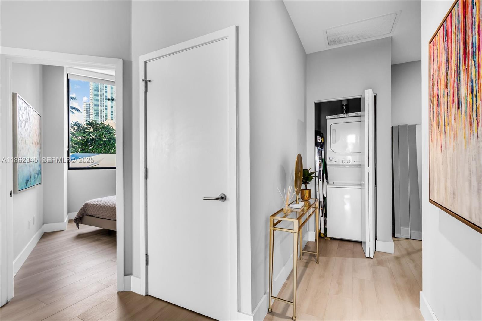 501 Northeast 31st Street, Unit 306 Miami, FL 33137 - Photo 6 of 65 a view of a hallway with a livingroom and a livingroom with furniture