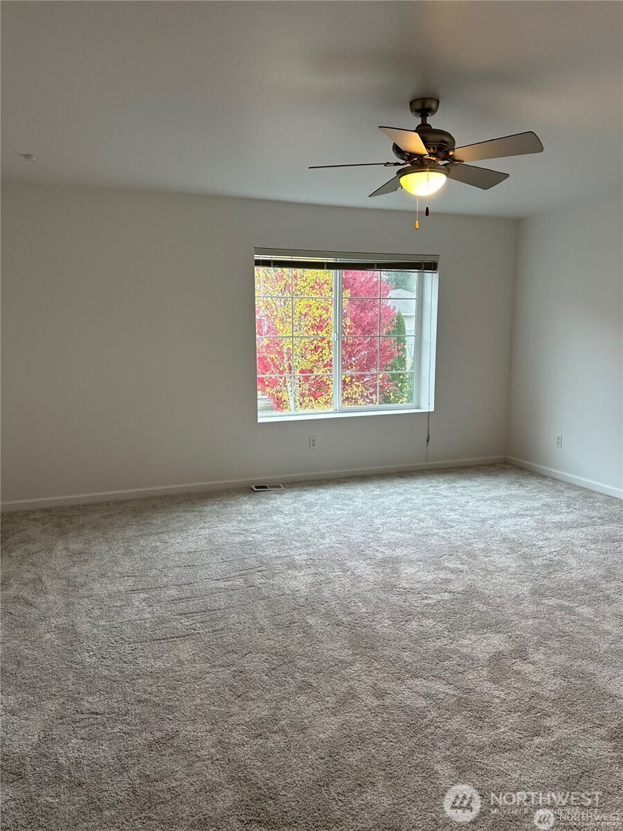 19114 14th Drive Southeast Bothell, WA 98012 - Photo 8 of 13 en empty room with windows