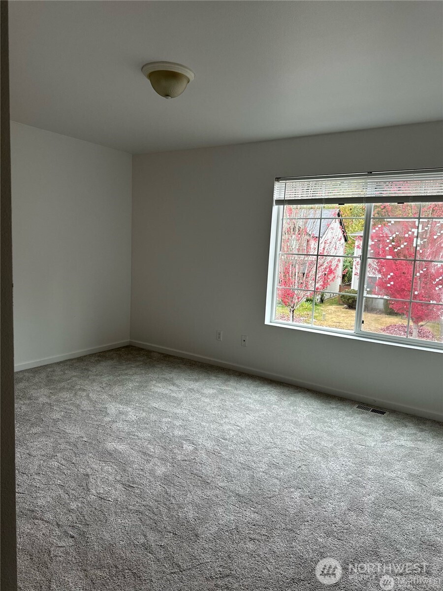 19114 14th Drive Southeast Bothell, WA 98012 - Photo 10 of 13 a view of an empty room with a window