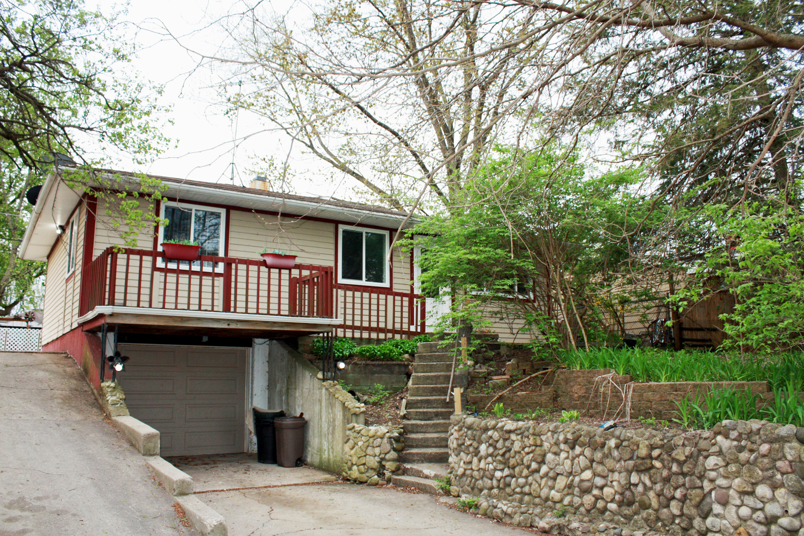 a view of a house with a balcony and door