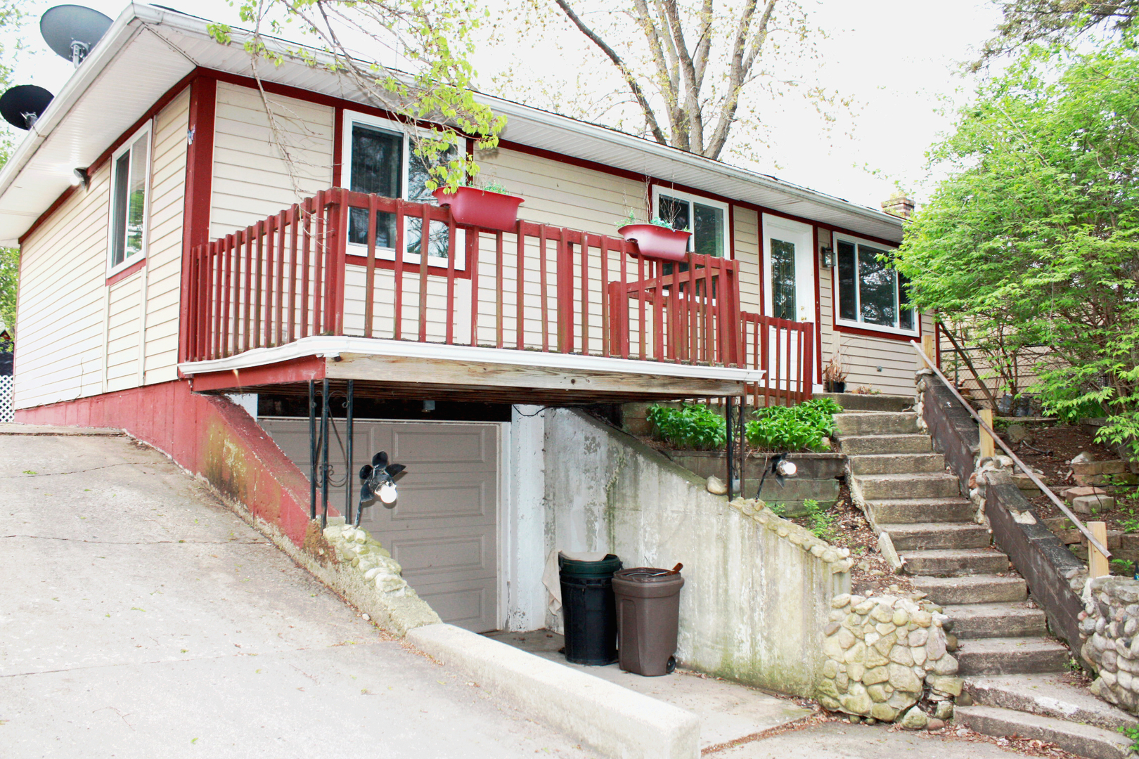 115 Kings Road Carpentersville, IL 60110 - Photo 2 of 16 a front view of a house with a garden