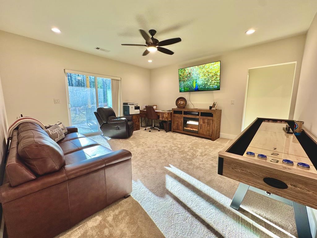 939 Sunset Road Epworth, GA 30541 - Photo 18 of 30 a living room with furniture and a flat screen tv