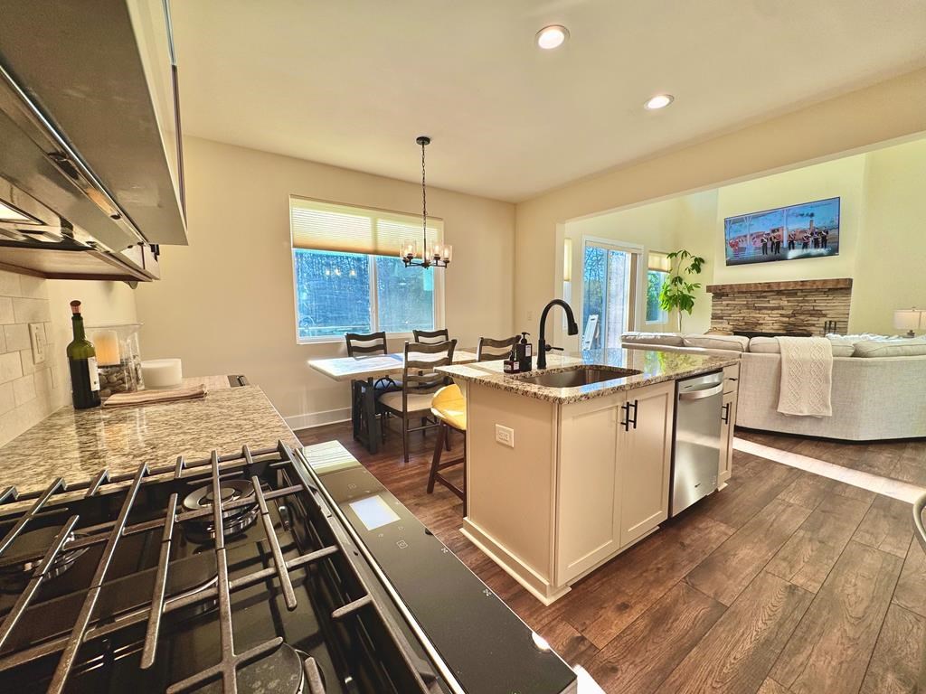 939 Sunset Road Epworth, GA 30541 - Photo 3 of 30 a kitchen with a sink stove and cabinets