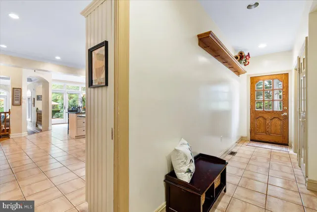 a very nice looking room with a large window and kitchen view