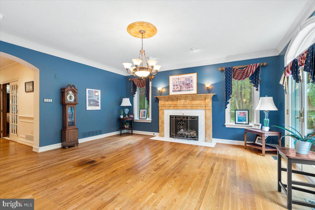 5948 White Flint Drive Frederick, MD 21702 - Photo 27 of 94 a view of a livingroom with a fireplace cabinet and windows