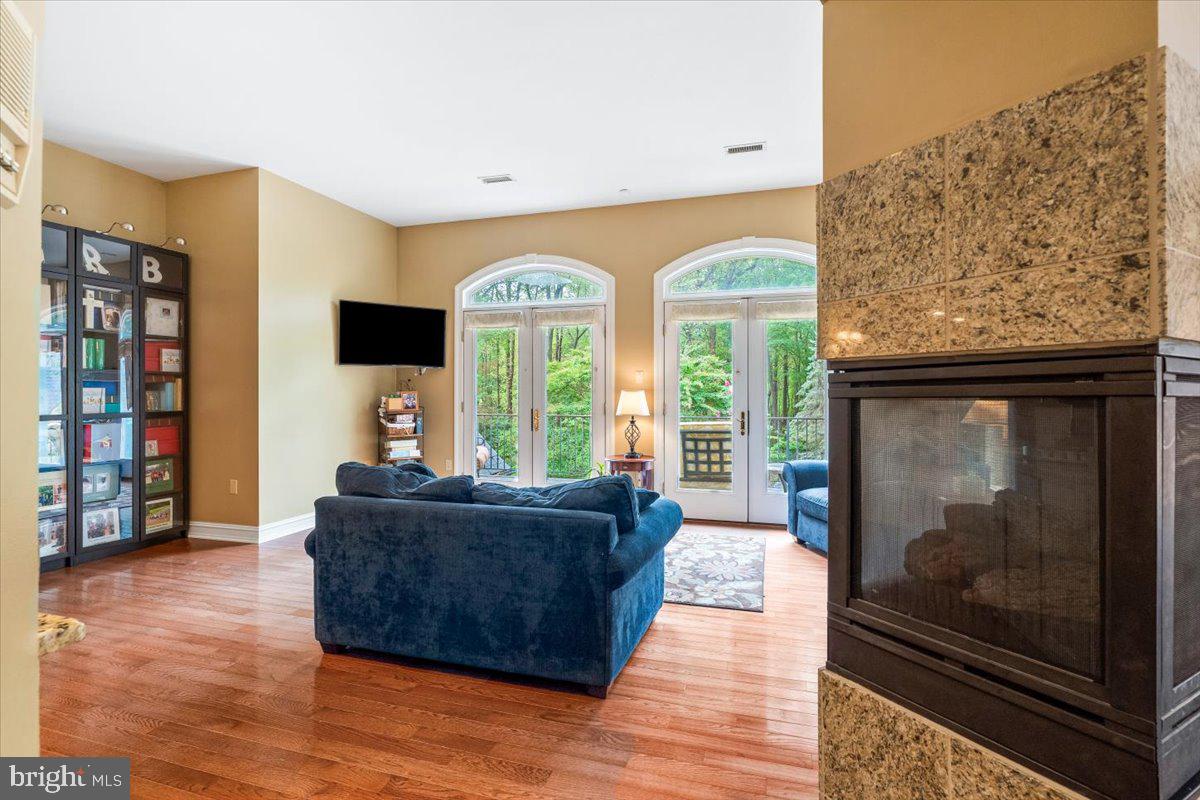 5948 White Flint Drive Frederick, MD 21702 - Photo 42 of 94 a living room with furniture and a fireplace