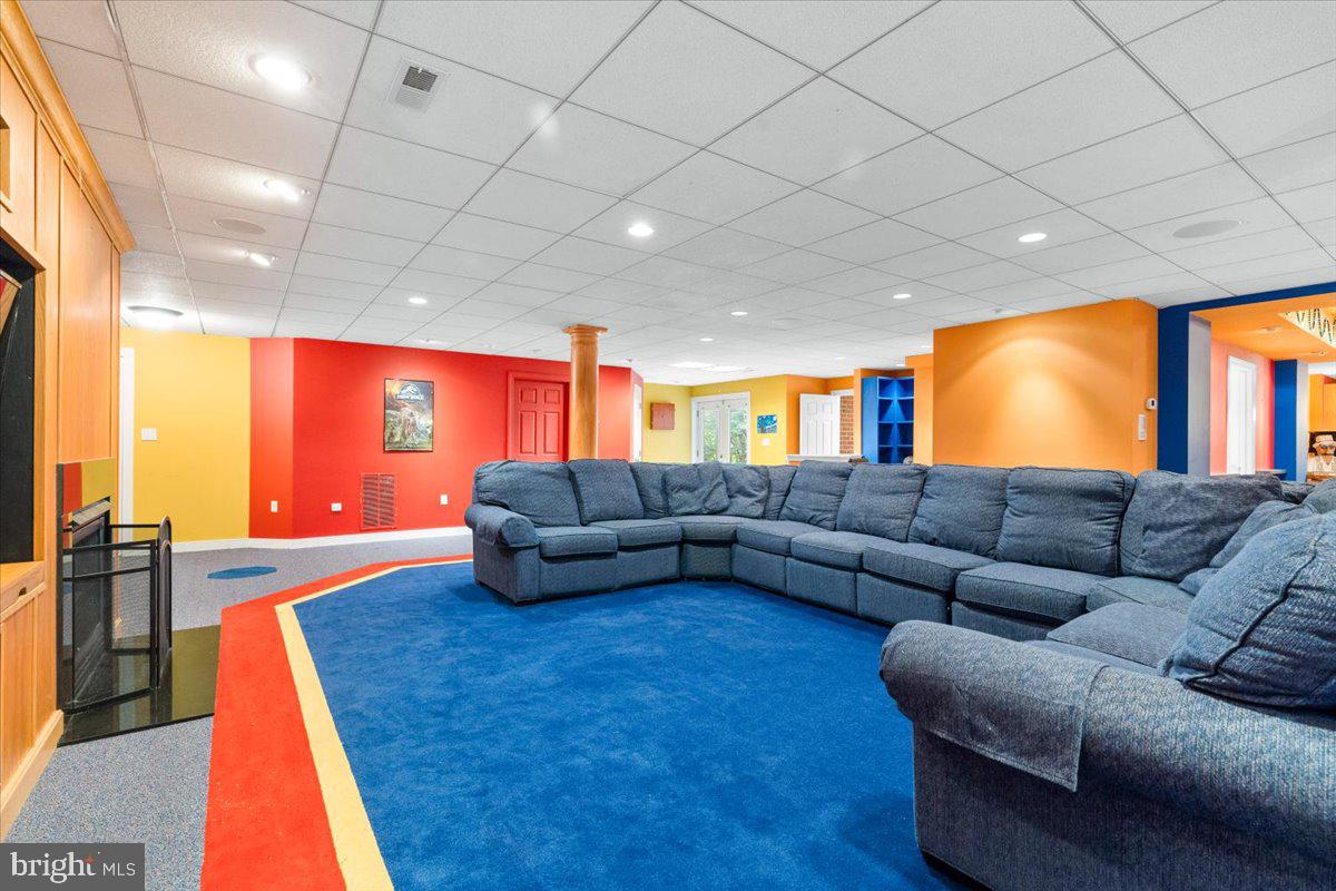 5948 White Flint Drive Frederick, MD 21702 - Photo 53 of 94 a living room with furniture and a flat screen tv