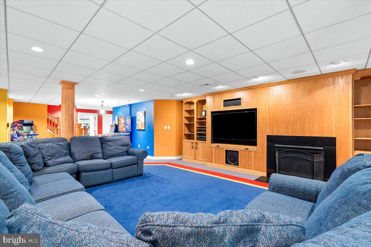 5948 White Flint Drive Frederick, MD 21702 - Photo 54 of 94 a living room with furniture and a flat screen tv