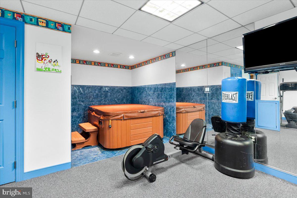 5948 White Flint Drive Frederick, MD 21702 - Photo 61 of 94 a room with furniture and flat screen tv