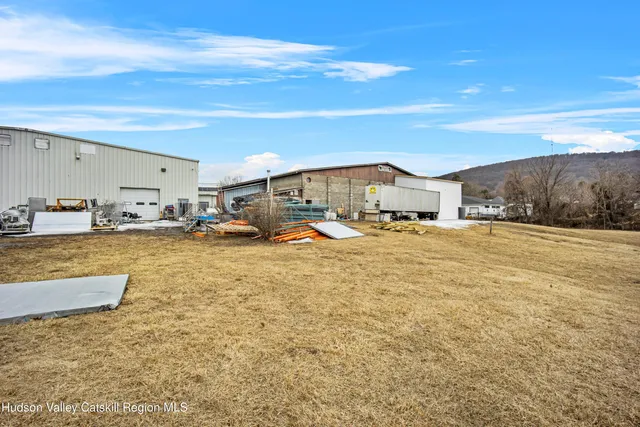 a view of a room with lots of wooden furniture
