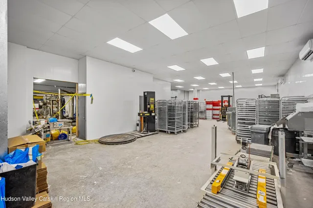 a large en suite bathroom with a double vanity sink and a large window