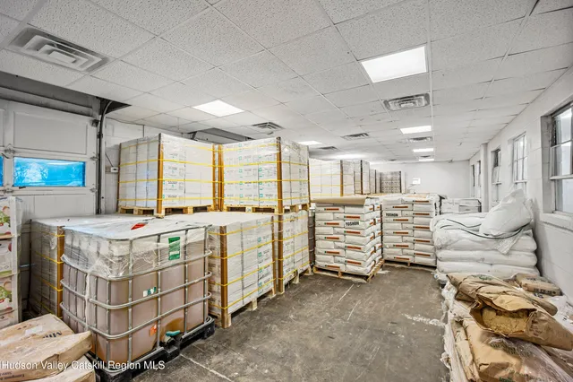 a view of a livingroom with furniture and a window