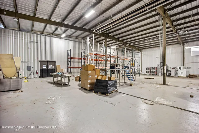 a living room with lots of furniture and a chandelier