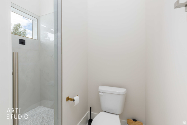 1188 South Old Trappers Loop Road Huntsville, UT 84317 - Photo 34 of 92 Contemporary shower enclosure featuring clear glass panels, a full-height window, and a pebble-tiled floor