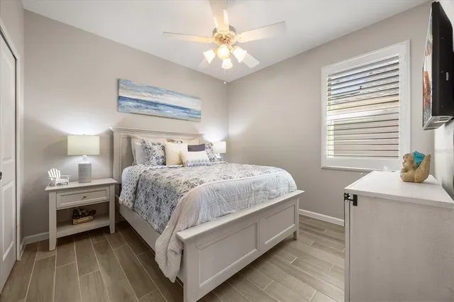 a bedroom with a bed and a table