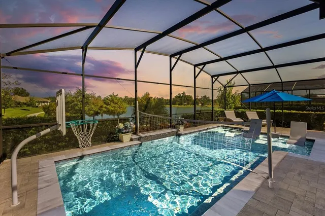 a view of swimming pool with a patio