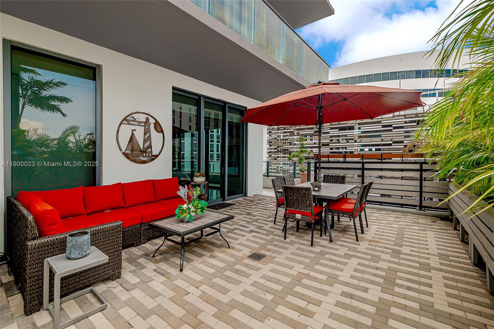 a view of a chairs with a table in a patio
