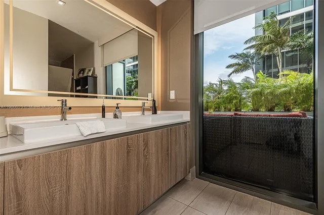 a bathroom with a sink and mirror