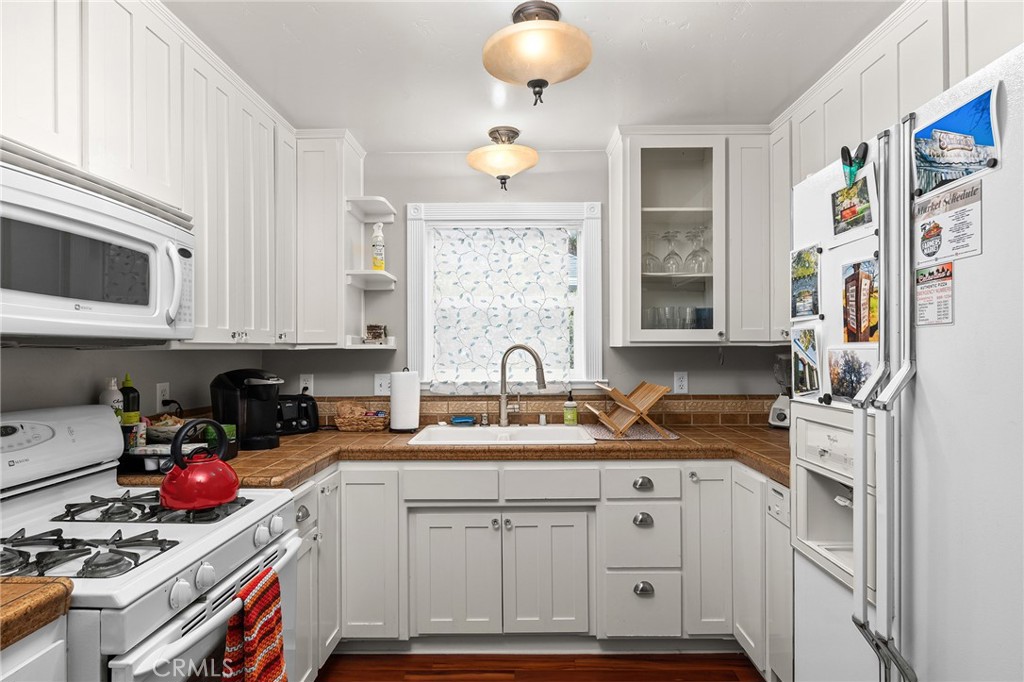 740 Orient Street Chico, CA 95928 - Photo 18 of 48 a kitchen with stainless steel appliances granite countertop a stove a sink and a microwave