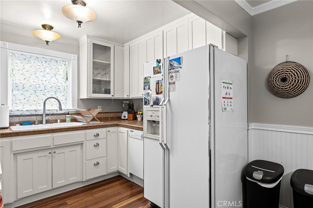 740 Orient Street Chico, CA 95928 - Photo 20 of 48 a white kitchen with sink stainless steel appliances and cabinets